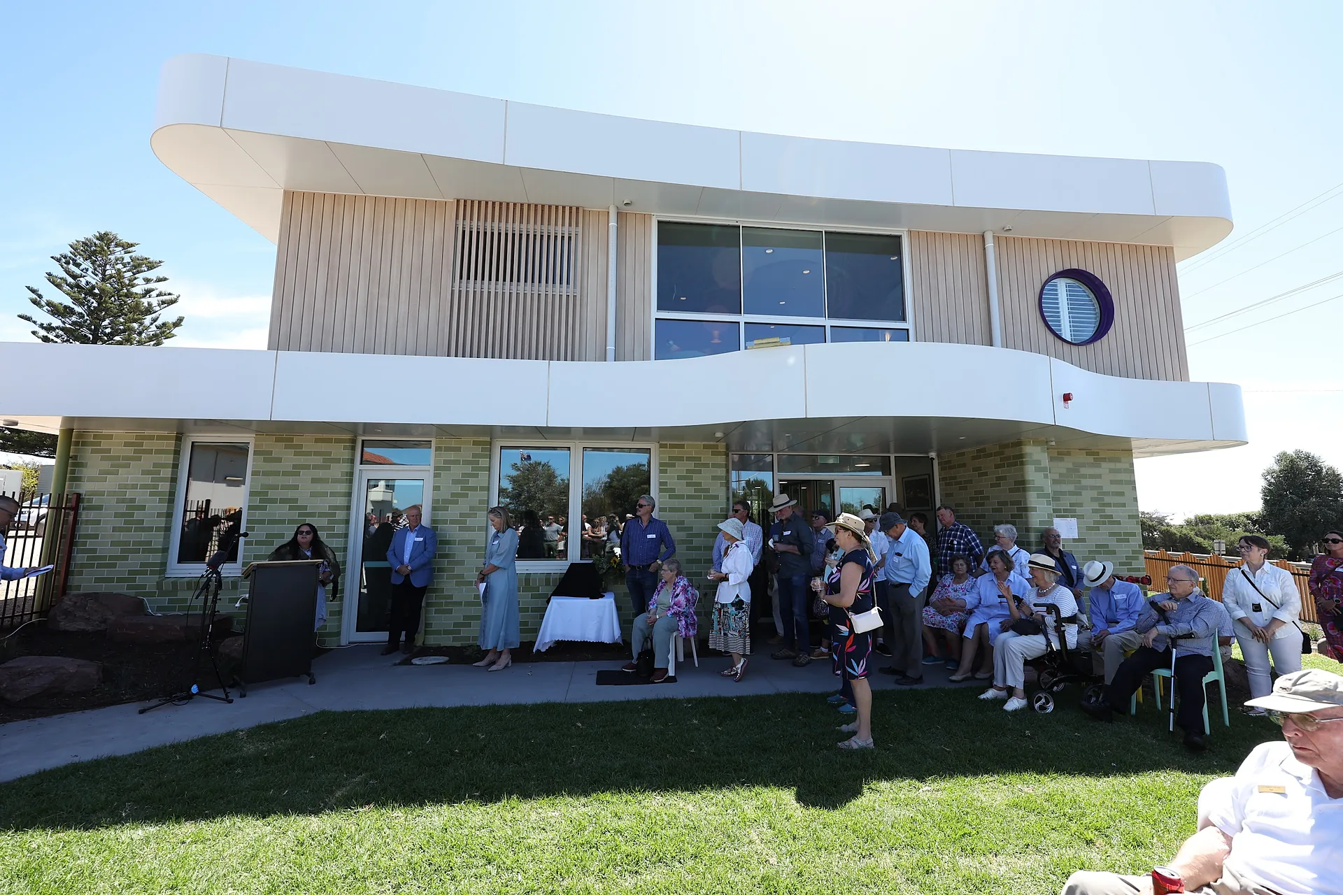 Guests gathered outside the new Riptide building at its official opening for Cottage by the Sea in Queenscliff, the story that ran on 7NEWS