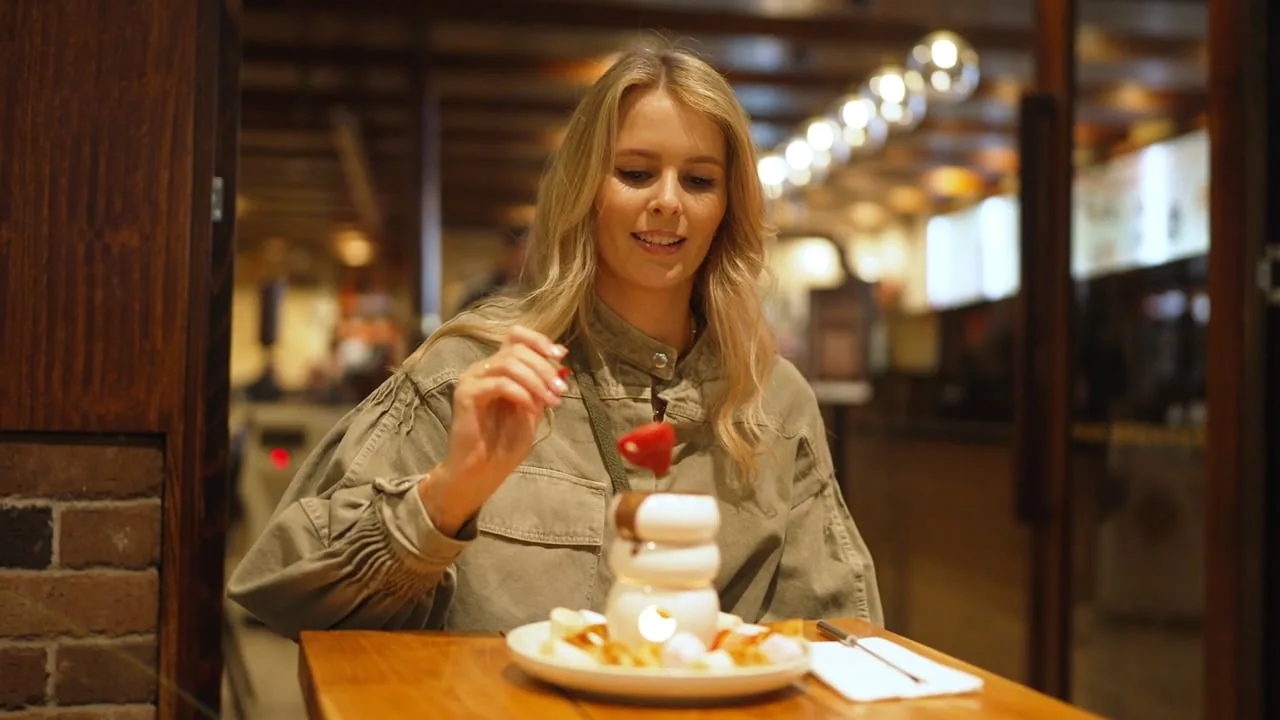 A still from a Zarco Creative commercial video: lifestyle scene in a warm-lit Sydney venue