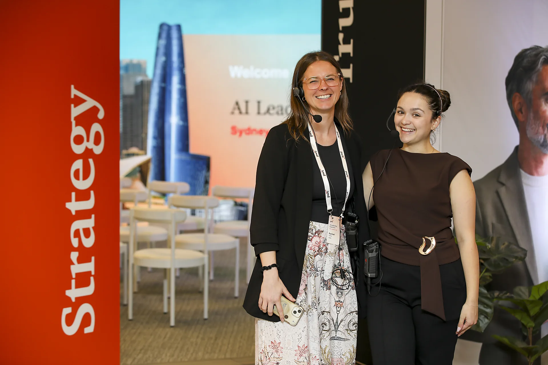 Two smiling guests at a corporate event in Sydney, filmed by Zarco Creative