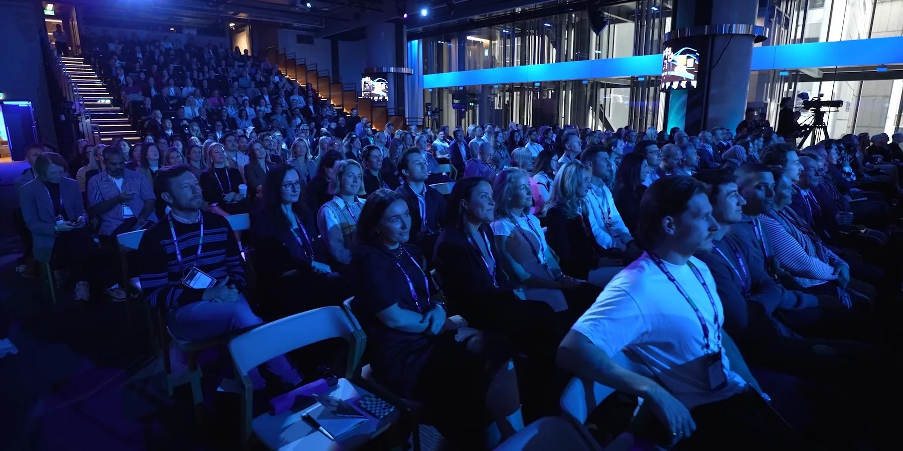 A packed, smiling audience at RESET 2026 in Sydney, filmed by Zarco Creative