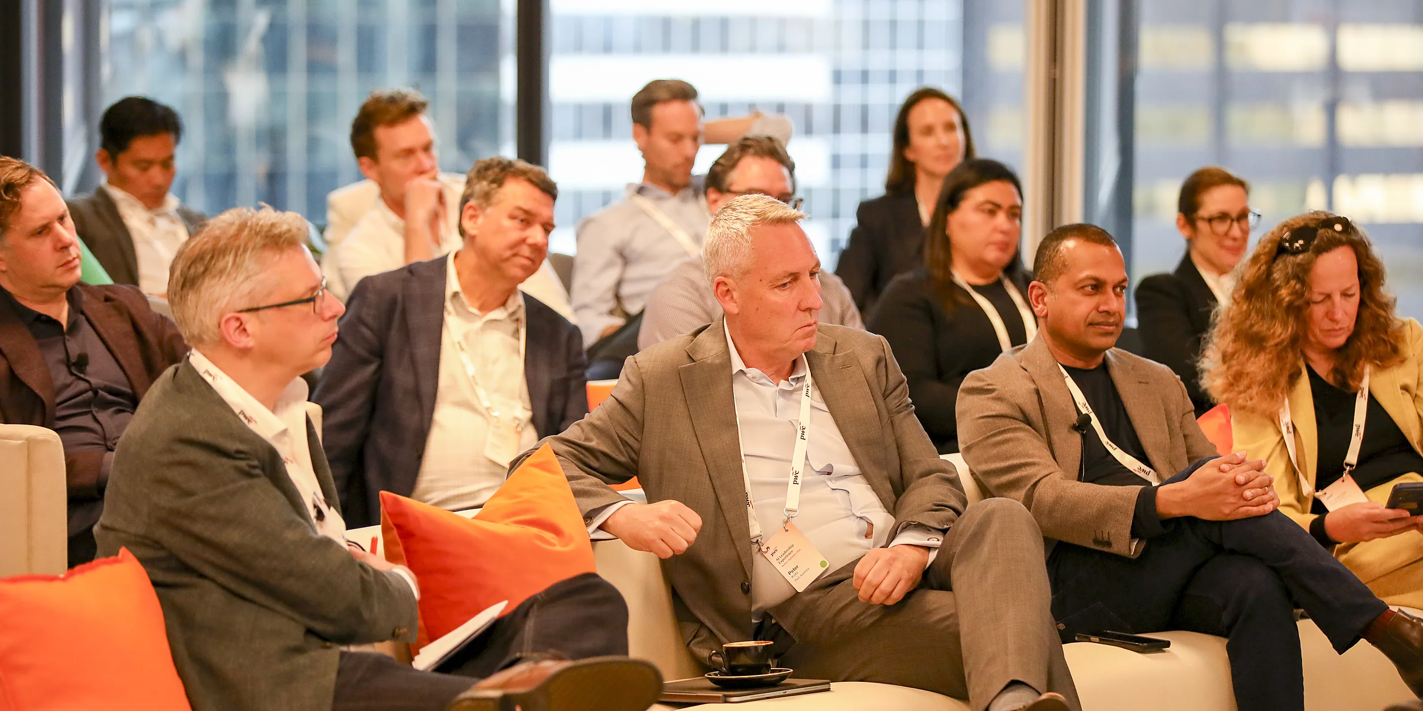Guests seated in a lounge at PwC's AI Leadership Experience in Sydney, filmed by Zarco Creative