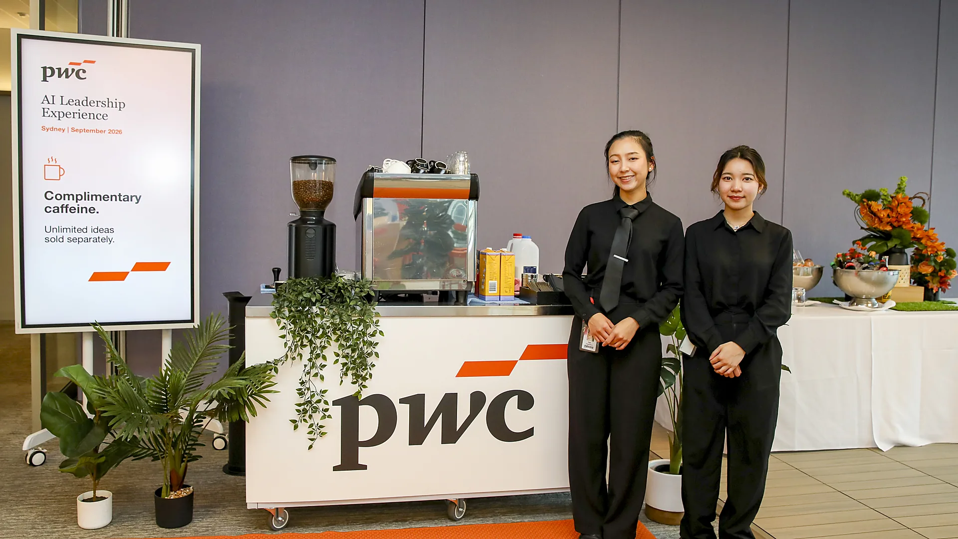 Two smiling staff at a branded coffee cart at a corporate event in Sydney, filmed by Zarco Creative