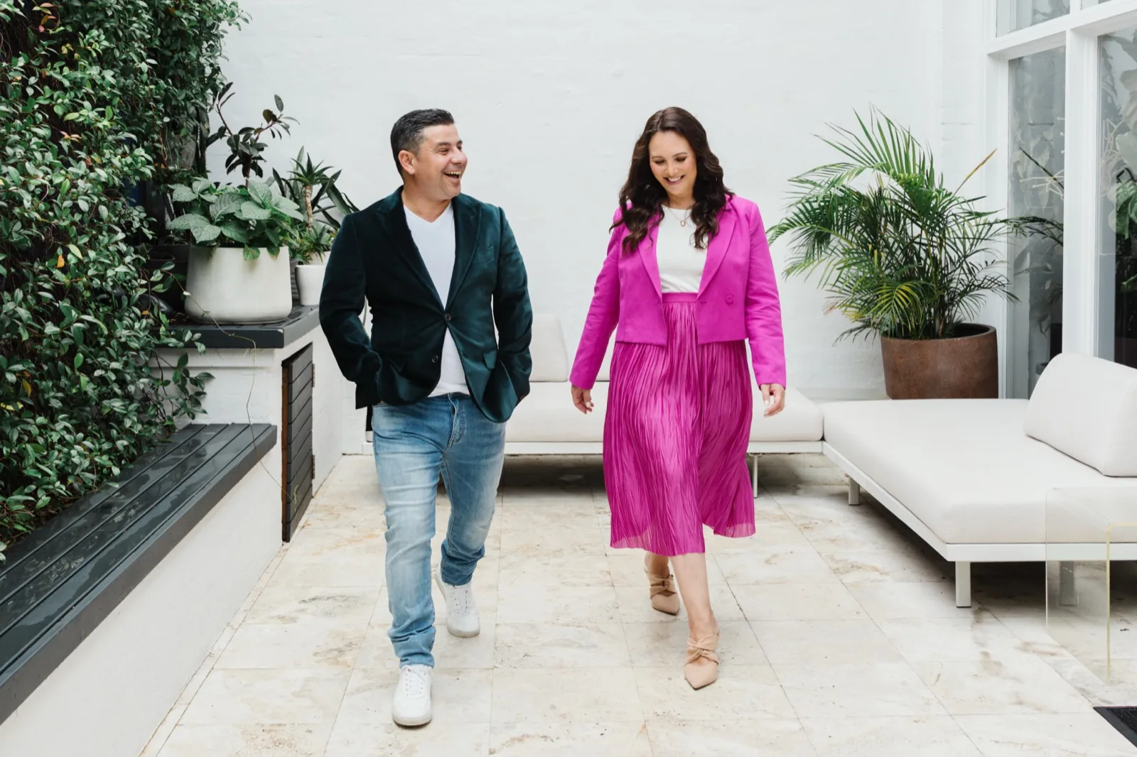 Jess and Oscar Vieira, founders of Zarco Creative, walking together