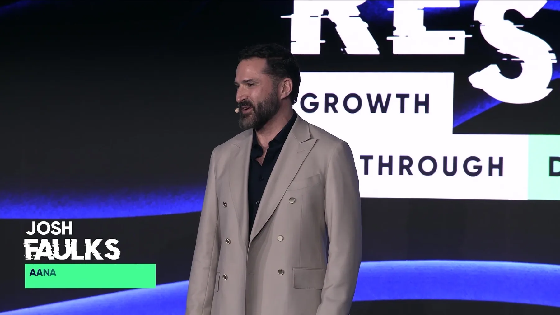 A speaker on the RESET 2026 stage in Sydney, filmed by Zarco Creative