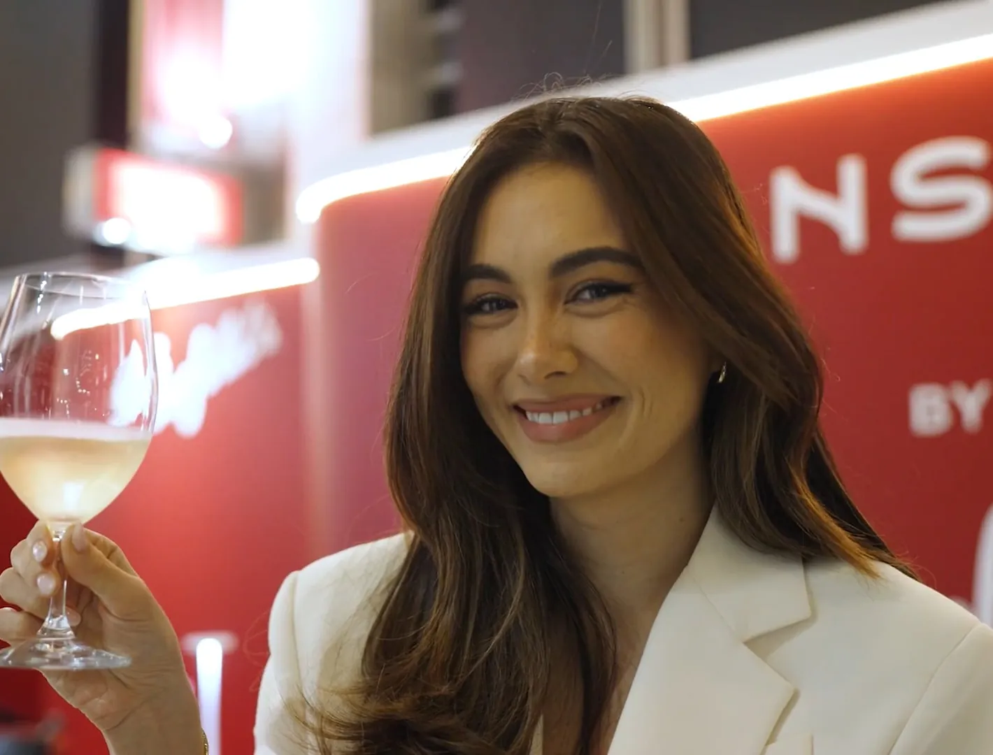 Penfolds host carrying tasting glasses at Transcend by Penfolds, filmed by Zarco Creative