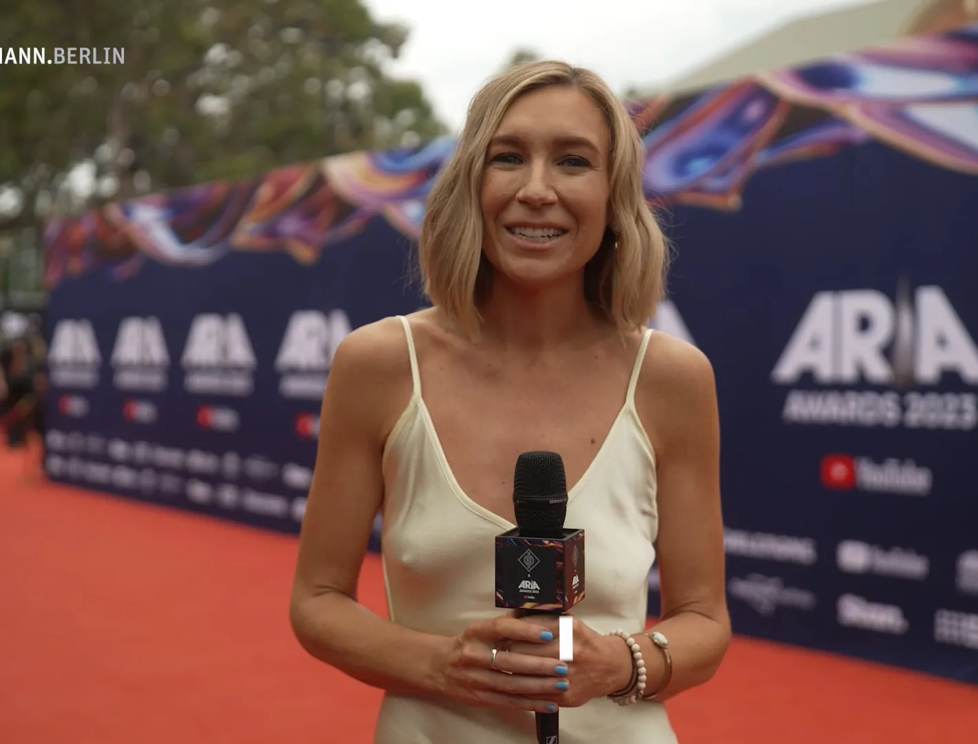 Presenter on the ARIA Awards red carpet with a Sennheiser microphone, filmed by Zarco Creative